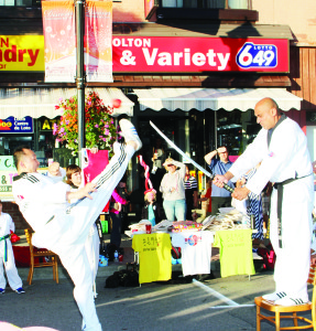 Master Seungyoung Kim of Bolton Taekwondo kicked an apple off this sword, which was held by instructor Valmeeky Singh.