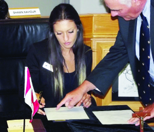 STUDENT TRUSTEE SWORN IN Bolton's Lexie Hesketh-Pavilons was officially sworn in as Student Trustee for the north at the Aug. 25 meeting at the Dufferin-Peel Catholic District School Board. She was welcomed by trustees and staff, including Director of Education John Kostoff (seen here). The evening also featured the dedication of the altar at the St. John XXIII Chapel at the Catholic Education Centre in Mississauga. Photo by Mark Pavilons