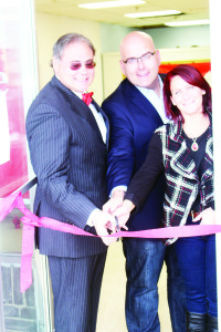 Ed Crewson received help from Steven Del Duca and Jackie McMillen, representing Mayor Allan Thompson, in cutting the ribbon to open his Bolton campaign office Sunday.