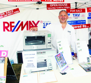Tav Schembri of Remax Realty Specialists was manning thois booth at the Fair Saturday.