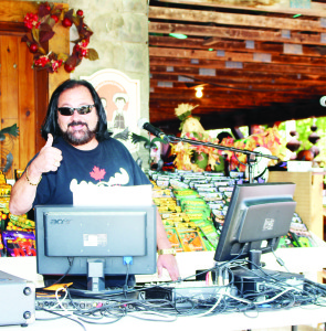 DJ Rock ‘N' Ray Michaels as he broadcasts live Saturday from the opening day of Pumpkinfest at Downey's Farm Market. Photo by Bill Rea