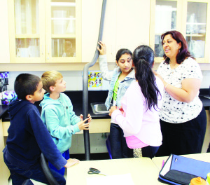 Teacher Swarnaly Modi was stressing the importance of team work to Harsh Shaw, Ryan Wilkie, Milika Purewal and Simreen Guram.