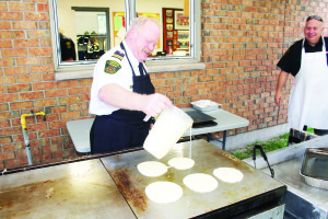 The Mono Mills Fire Hall was the scene recently of the annual open house. The morning included a pancake breakfast. District Chief Brian Zimmerman was demonstrating his skill at the grill. Photos by Bill Rea