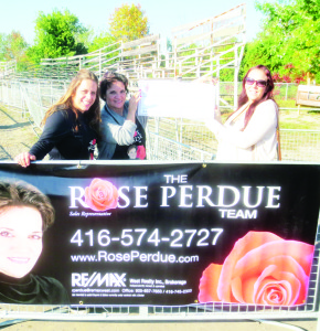 Stephanie Hofmann and Rose Perdue of the Rose Perdue Team presented this cheque for $700 to Nicki Tame, a counsellor at Peace Ranch.
