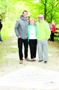 Jake and Beverly Holden stand next to their stone on Caledon's Walk of Fame with Jeff Holden, who nominated them.