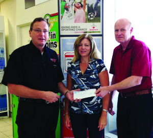 CANADIAN TIRE GETS CONTRIBUTION FOR JUMPSTART Chris Hartleib from Canadian Tire Bolton recently received two cheques presented by Cindy Sliwocki and Bob Holmes of Torbsa Limited in Bolton. Torbsa had a golf tournament in July with their shareholders and vendors. A total of $3,420 was donated by Torbsa and Select Acoustic Supply Inc. to Canadian Tire Jumpstart Charities. No kid should be left on the sidelines, but in Canada one in three families cannot afford to enroll their children in organized sports. Money raised for Jumpstart stays within the community and goes directly to help kids participate in sport, dance or other organized physical activities. Jumpstart funding helps families that need a financial hand with registration and equipment. All customer donations go directly to help kids in need. Submitted photo