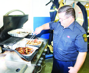 Breakfast in Alton Alton Fire Hall was the scene of an open house Saturday morning in recognition of October being Fire Prevention Month. Firefighter Tim Rowe was working on cooking the sausage.