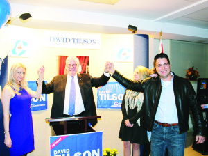 Newly re-elected MP David Tilson was flanked by his campaign managers Nicole Robins and Kevin Weatherbee in celebrating his victory in Mondays federal election. Photo by Bill Rea