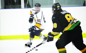 Golden Hawk Daniel Cafagna looks for an outlet to pass to in the Alliston end Sunday night.