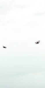Neil Anderson of Cheltenham was flying the SE 5A (left) while Mike Smith of Milton was at the controls of the Fokker DRI, as they re-enacted the shooting down of the Red Baron (Manfred von Richthofen). There is debate as to whether the Baron was shot down from the air or ground. One of the theories is his assailant was Canadian Captain Roy Brown. There were also men fring from the ground, representing the re-enactment of the Princess Patricia's Canadian Light Infantry.