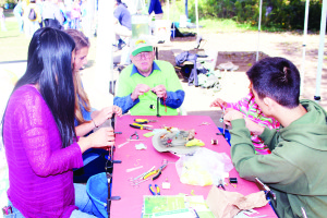 Belfountain was a pretty busy place recently for the annual Belfountain Salamander Festival. Pat Kelly of the Izaak Walton Fly Fishing Club was offering fly-tying tips to those at the Festival. Photos by Bill Rea