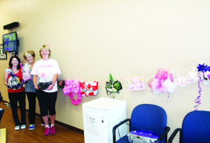 CURVES RAISING MONEY TO FIGHT BREAST CANCER Curves in Bolton was raising money in October in support of the Canadian Breast Cancer Foundation, Ontario Branch. They are making $30 donations when someone joins in October, and they are waving the service fee. There is also this display of bras that members have designed and breast cancer survivors will be judging. Members and local businesses like Paganelli's Bar and Osteria, travelmyway.com, Angela's esthetics and Forsters Book Garden have been creating gift baskets that will be raffled off. Curves proprietor Jeannie Ellison is seen here with members Carol Basham and Connie Critchley. Photo by Bill Rea