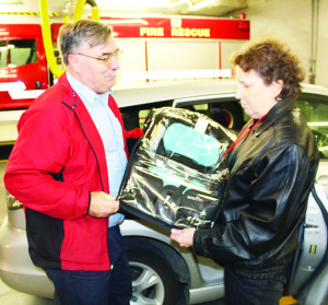 CHILD CAR SEAT CLINIC IN BOLTON Caledon OPP Auxiliary officers recently held the latest of their child car seat clinics at the Fire Hall in Bolton. Aux. Sergeant Jim Drake was showing Brampton resident Kathryn Toliver how to adjust this seat for her grandson. The next clinic is scheduled for Nov. 24 from 6:30 to 8:30 p.m. at the fire hall at 28 Ann St. in Bolton. It will be by-appointment only. Call 905-584-2241 for more information or to book an appointment. Photo by Bill Rea