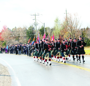 Remembrance services were held Sunday in Caledon East and Mono Mills to remember Canadian service personnel who have fallen in wars, peacekeeping operations and other military actions. Members of the Sandhill Pipes and Drums led the parade to the Cenotaph at Town Hall. Photos by Bill Rea