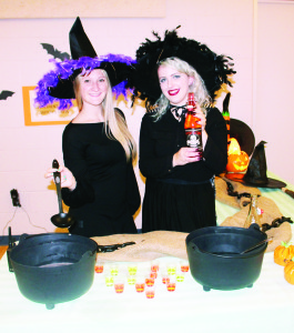 Jenn Dick and Lexa Castellan were serving up some kind of witch's brew. Photos by Bill Rea