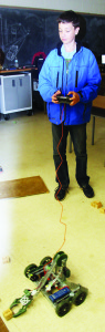 Allan Drive Middle School Grade 8 student James Smissen was trying out some of the robotics equipment at Humberview.
