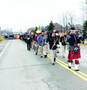 CALEDON REMEMBERS Captain Don Rea led the procession, consisting of members of the Caledon Fire and Emergency Services Honour Guard and staff and students at Robert F. Hall Catholic Secondary School in the parade to the Cenotaph outside Town Hall in Caledon East yesterday morning for the annual Remembrance Day observances, hosted by the Town. Turn to page A9 for more scenes of Remembrance services. Photo by Bill Rea