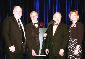John Weir, Craig Collins and Bob Carey of Equestrian Management Group accept the Jump Canada Hall of Fame Award in the category of Builder (Organization) from Canadian Olympian Beth Underhill. Photo by Michelle C. Dunn