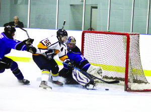 Daniel Cafagna dekes out Penetang goalie Hunter Ferguson to score in the third period of Caledon's 5-4 win over the Kings at Caledon East. Photo by Jake Courtepatte