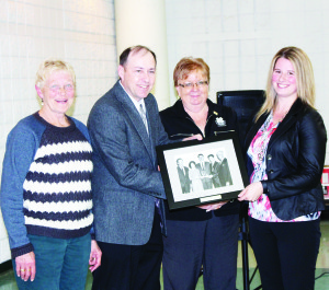 Lindsay Bebbington (right) was presented with the 4-H Outstanding New Leader Award, sponsored by Gay Lea Foods Co-operative Limited. Making the presentation were 4-H volunteer Betty Brander, Bill Reid of Gay Lea and Evelyn Chambers of 4-H Ontario.