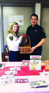 FIRE SAFETY INFORMATION OFFERED Caledon Fire and Emergency Services were represented last Saturday at the Christmas Market Place at St. Cornelius Elementary School in Caledon East. Public Education Officer Gillian Boyd and Firefighter Darryl MacArthur were manning this table, distributing safety information. Photo by Bill Rea