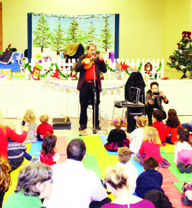 There were plenty of happy young folks at the Albion-Bolton Community Centre recently for the annual Christmas party hosted by Caledon Parent-Child Centre. Popular Children's performer Lenny Graf from Treehouse TV had the young folks entertained with his songs and antics. Photos by Bill Rea