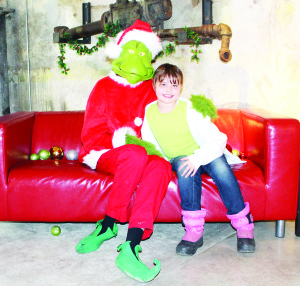 YOU'RE NOT SUCH A BAD ONE, MR. GRINCH The Grinch has been see about Alton Mill Arts Centre lately, having his picture taken with his fans, like Katarina Witty, 8, from Guelph who was visiting her grandparents who live in Mono Mills. The Grinch will be around this coming Saturday and Sunday, and the following weekend from noon to 4 p.m. Photo by Bill Rea