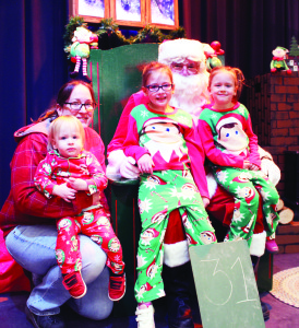 Santa welcomed to Herb Campbell There was a packed house in the gym at Herb Campbell Public School Saturday morning in honour of the 30th annual Breakfast with Santa. Thos on hand to greet the jolly old elf included members of the Hay family. Amy Hay was there with Ryland, one and a half, Lily, 7, and Ivy, 5. There were some other fun things going on at Herb Campbell Saturday, including face painting. Annelisa Fischer, a volunteer, was finishing her work on Grade 3 student Leyla Garcia. Photos by Bill Rea