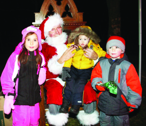 Santa Claus made a grand entrance to the festivities, and lots of young folks were anxious to meet him, including Sierra Dehart, 5, of Palgrave, and her brother Jacob, 4, and sister Emma, 2.