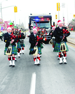 Members of the Sandhill Pipes and Drums were marching near the start of the parade. Photos by Bill Rea
