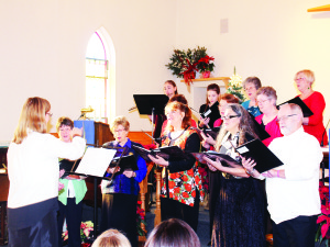 CHRISTMAS CONCERT AND CAROL SING The sounds of the season filled Caledon East United Church Sunday afternoon as they put on their Christmas Concert and Carol Sing. The Church Choir was accompanied by flautist Stefani Matis on this piece. Photo by Bill Rea