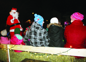 Santa Claus had lots of company as he took a hay ride through the streets of the hamlet. Photos by Bill Rea