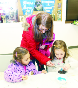 Sara Zahra of Caledon East was watching as her daughter Lea, 5, (right) and Cristiana Mamone, 5, worked on crafts involving marshmallows.