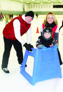There was skating at WinterFest. Ari Wyka, 5, of Brampton, was taking to skates for the first time, assisted by his parents Bart and Urszula.