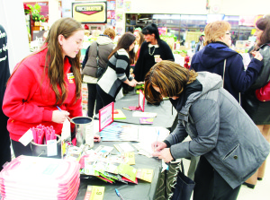Ladies' Night attracts the crowds The floor of the United Lumber Home Hardware was a very busy place recently for Ladies' Night. There were lots of goodies being given out, as well as demonstrations. There were draws at Ladies' Night. Cashier Megan Remnant watched as Deanna Rulli of Caledon East filled out her ticket. Photos by Bill Rea