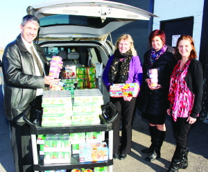 Caledon Community Services (CCS) received a major contribution of donated food items recently at the Exchange. Jim Rowland of Rowland Investments and Insurance Inc. was accompanied by his wife Bente and Julianne Carras in delivering the items to Kim D'Eri, manager of community animation with CCS. Rowland is also a five-star master builder with Manulife Securities. As such, he will be submitting a receipt to Manulife, and they will be matching his donation. “It's a fabulous way of doubling up donations,” he said. The contributions included items CCS is in need of, like cereals, canned vegetables, meat and fruits. Photo by Bill Rea