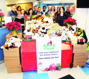 Associates at the Sears Canada Vaughan National Logistics Centre south of Bolton recently had a very large pile of toys to contribute to the efforts of Caledon Community Services (CCS) and the annual Santa Fund. Deanna Hart, Mary Falcone and Shona Lauzon of CCS were on hand to collect it all. Photo by Bill Rea