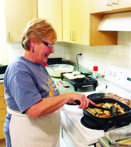 Knox Church was filled with hungry diners Tuesday night. Sharon Lambert was busy in the kitchen preparing the sausage.