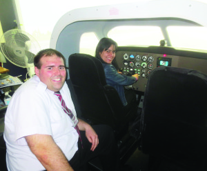Instructor Bryan Halfyard was guiding Carolina Hephner of Cambridge as she got to try out one of the simulators.