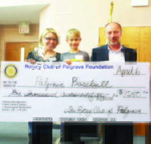 Carter Dyck, 8, accepted this cheque to Palgrave Baseball for $1,250 from Rotarian Krysta Cadden and Club President Jim Firth.
