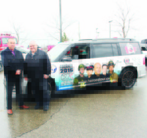 Bob Fines of Fines Ford Lincoln is seen here with Vince Savoia and one of the vehicles Fines is providing for the Heroes are Human 2016 Tour.