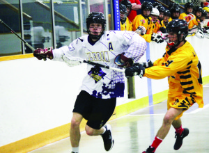 Scott Edwards brushes past a Warriors defenseman in the Caledon Bandits' 11-6 loss to Brantford at Mayfield Recreation Complex last Tuesday. Photo by Jake Courtepatte