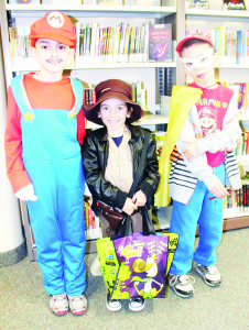 There were plenty of costumes, inspired by various cartoon figures. Maia Spatone won the class for those 12 and younger, dressed as Indiana Jones. Maia was flanked by brothers Gianluca, dressed as Mario, and Alessio, dressed as Roblox Man. Photos by Bill Rea