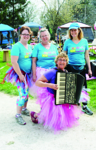 CHELT CHICKS AT IT AGAIN Kim Bernard (seen here holding the accordion) had lots of help recently hosting the annual yard sale at her Terra Cotta home to raise money for the Walk to End All Cancers, which will be run by Princess Margaret Cancer Centre in September. She was joined by fellow Chelt Chicks Cheryl Mills and Martha McLellan, both of Cheltenham, as well as Susan McCloy from Toronto. This is the 11th year they have held the sale, and over that time, they have raised close to $70,000. Photo by Bill Rea