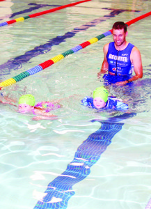C3 pro Sean Bechtel was taking part in the swimming portion of the event guiding his niece Aleigh Mulder, 7, and his son Ross, 2, through the competition.