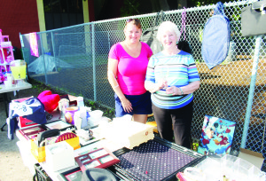RUMMAGE SALE AT BOLTON UNITED There were lots of interesting items for sale in the parking lot at Bolton United Church recently. The occasion was the church's annual Rummage Sale. Kim Kirsten and Marg Boughen were on hand to assist the customers. Photo by Bill Rea