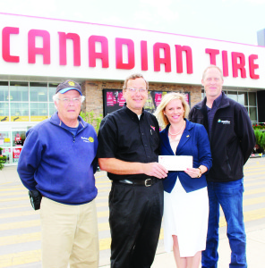 Rochon, Innis and Clark were at the Bolton Canadian Tire to receive a contribution from store proprietor Chris Hartleib.