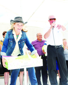 The opening ceremonies included the auctioning off of assortments of baked goodies. Councillor Barb Shaughnessy was assisting as Allan McMaster took in the bids.