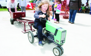 Caledon village area resident Allison Graham, 5, was giving it all she had in the Pedal Pull.