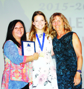 The R.C. Honey Award goes annually to a person who is greatly involved in athletics, demonstrates good sportsmanship, has a strong commitment to academics and respects others. Nancy Gilliard and Christine Huet presented it to Hannah Portch.